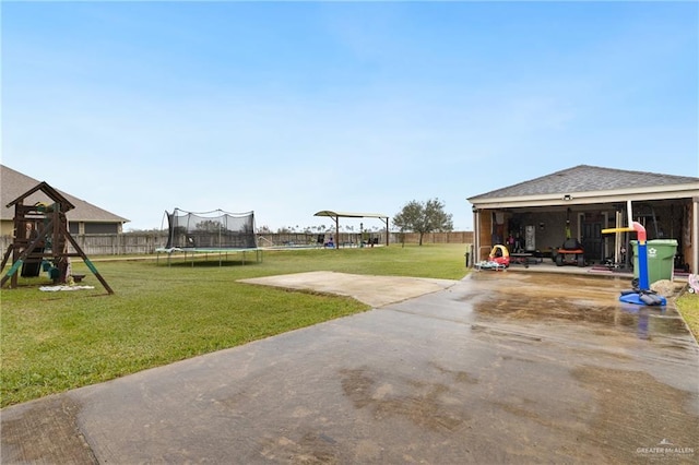 view of yard with a playground, a patio area, and a trampoline