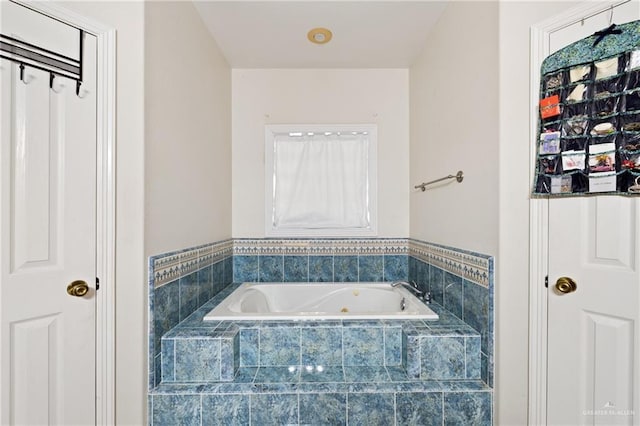 bathroom featuring tiled bath