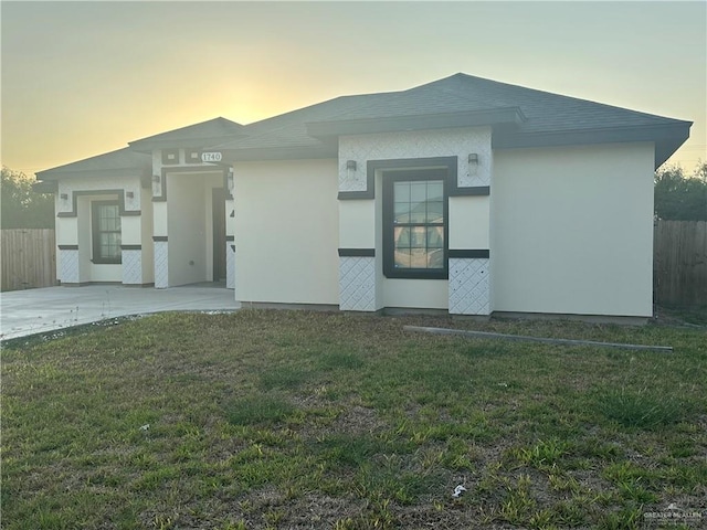 view of front of home with a lawn