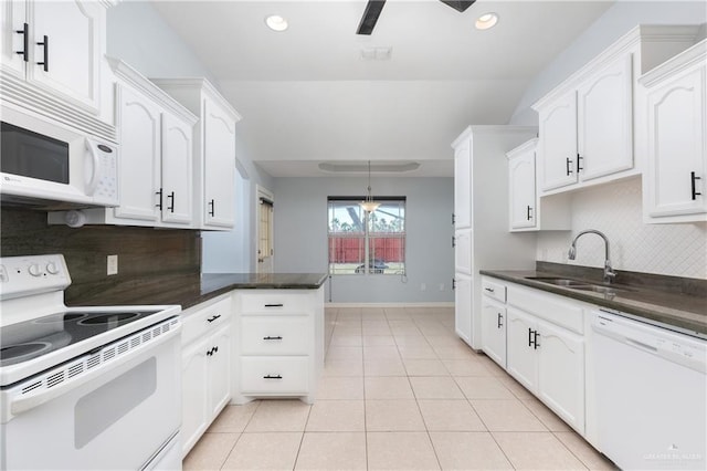 kitchen with white cabinetry, sink, and white appliances