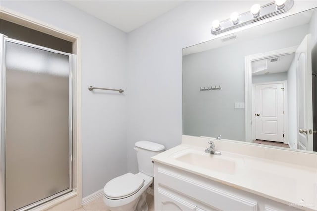 bathroom with vanity, toilet, and an enclosed shower