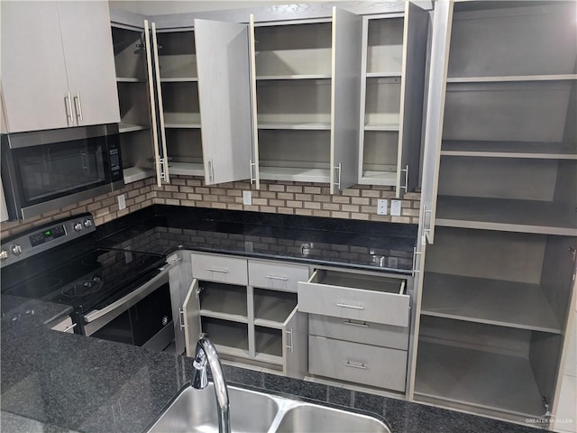 4012 Whitewing Ave, Edinburg, TX 78539 - kitchen featuring decorative backsplash, appliances with stainless steel finishes, open shelves, a sink, and white cabinets
