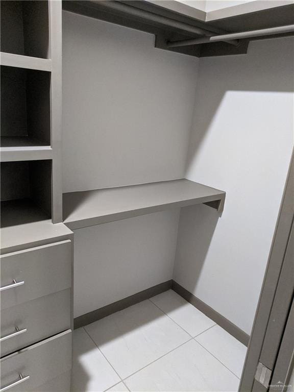 4012 Whitewing Ave, Edinburg, TX 78539 - walk in closet featuring light tile patterned floors