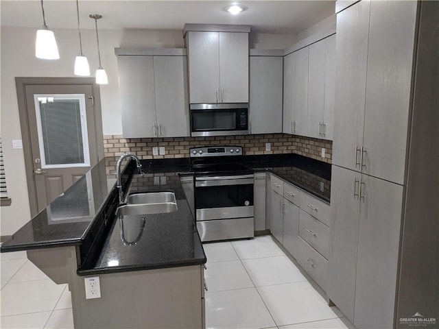 4012 Whitewing Ave, Edinburg, TX 78539 - kitchen featuring backsplash, a sink, light tile patterned floors, a peninsula, and stainless steel appliances