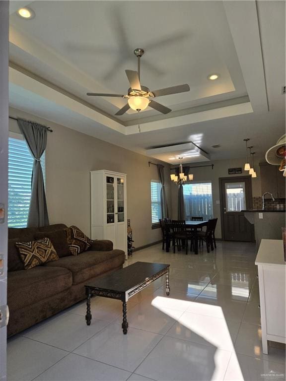 4012 Whitewing Ave, Edinburg, TX 78539 - living area featuring recessed lighting, a raised ceiling, ceiling fan with notable chandelier, and tile patterned floors
