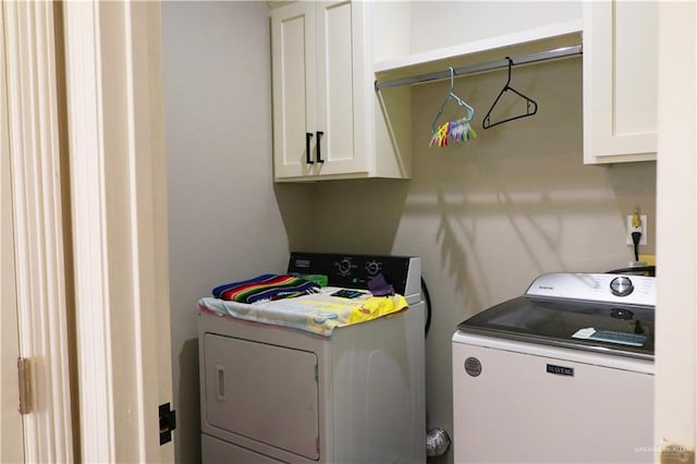 506 Oak Ridge St, Donna, TX 78537 - washroom with cabinet space and washer and dryer