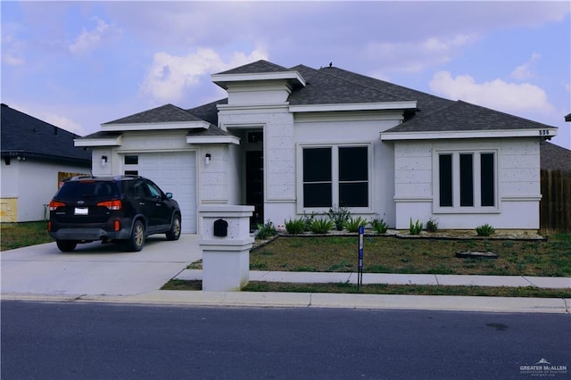 506 Oak Ridge St, Donna, TX 78537 - view of front of house with driveway, a shingled roof, and an attached garage