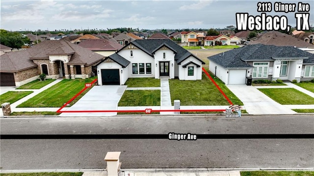 french provincial home featuring a front lawn and a garage