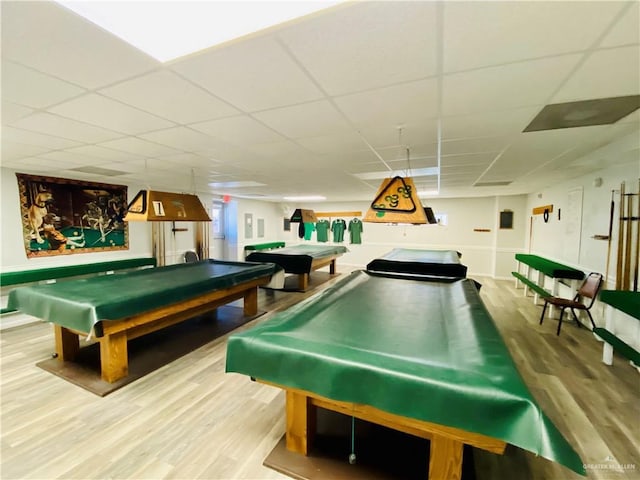 rec room featuring billiards, a paneled ceiling, and hardwood / wood-style floors