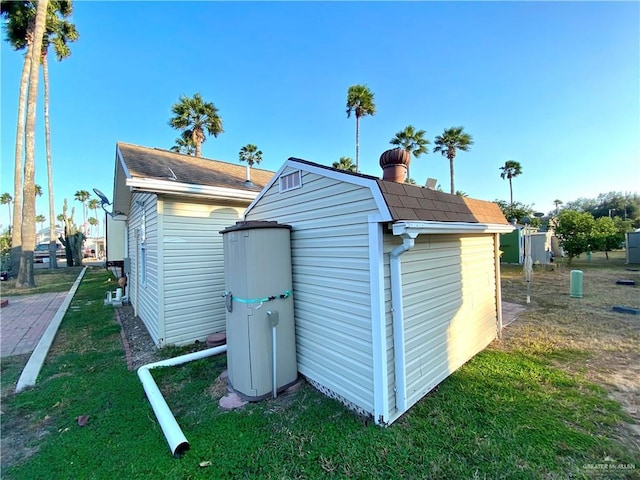 view of outbuilding with a lawn