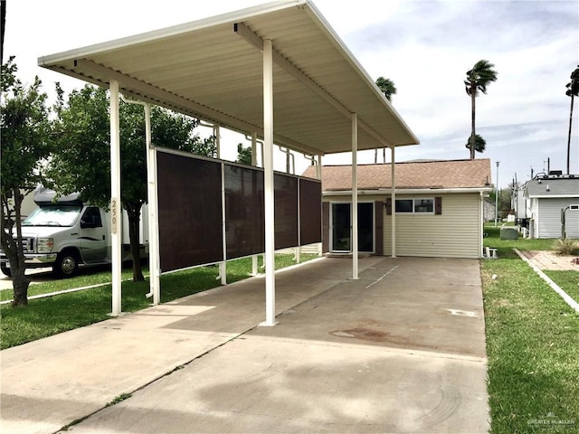 view of parking with a lawn