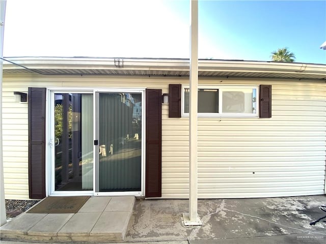 doorway to property featuring a patio