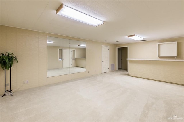 basement with carpet and visible vents