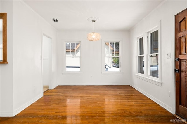 unfurnished dining area with hardwood / wood-style floors