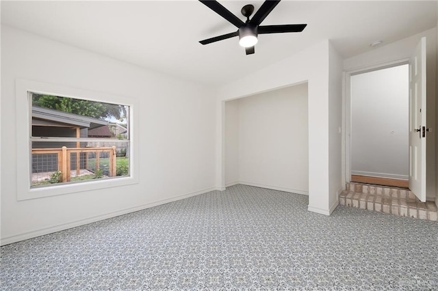 interior space with ceiling fan and lofted ceiling