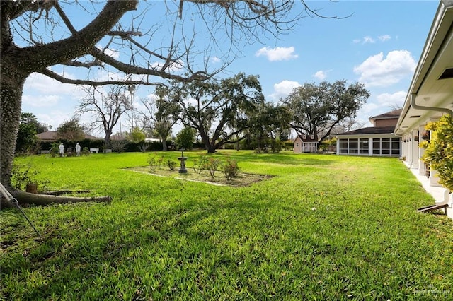 view of yard with a sunroom