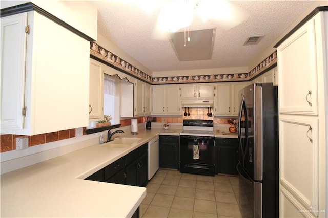 kitchen featuring electric stove, white cabinetry, stainless steel refrigerator, and dishwasher