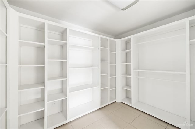 spacious closet with tile patterned flooring