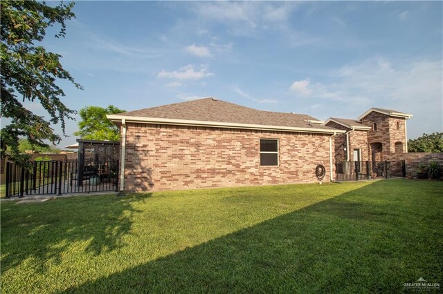 14616 Kurth Cv, Mcallen, TX 78504 - rear view of house featuring brick siding and roof with shingles