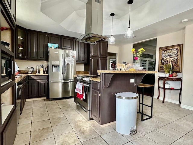 kitchen featuring island range hood, a breakfast bar, a kitchen island, appliances with stainless steel finishes, and dark brown cabinetry