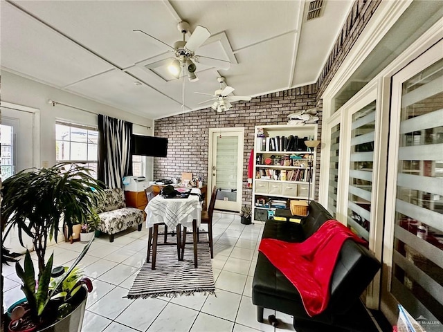 sunroom / solarium with ceiling fan and vaulted ceiling