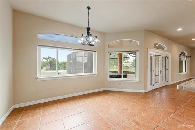 12612 E Clark Rd, La Feria, TX 78559 - spare room featuring light tile patterned flooring, a chandelier, recessed lighting, and baseboards