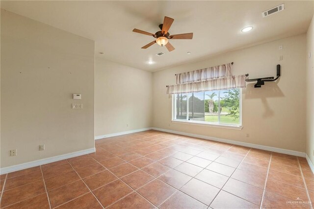12612 E Clark Rd, La Feria, TX 78559 - empty room featuring tile patterned floors, a ceiling fan, baseboards, and recessed lighting