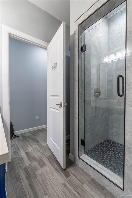 bathroom with a shower with shower door