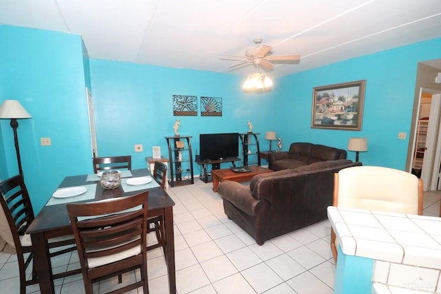 tiled living room featuring ceiling fan