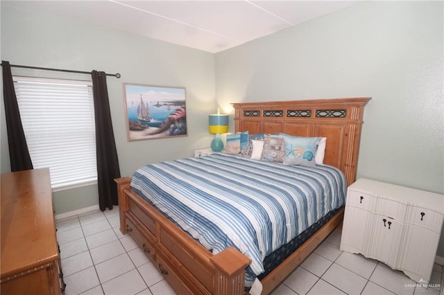 125 E Georgia Ruth Dr Unit B202, South Padre Island, TX 78597 - bedroom with light tile patterned floors and baseboards