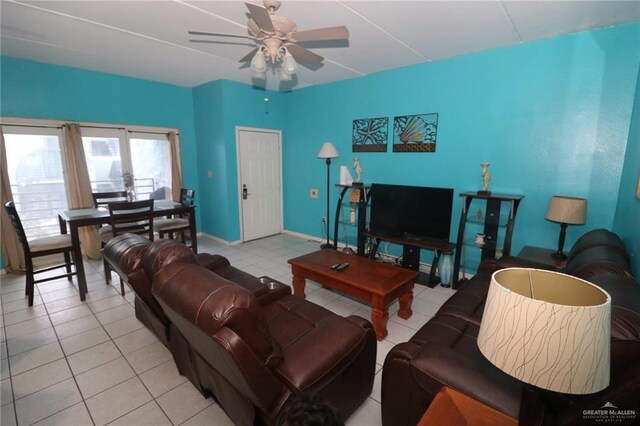 125 E Georgia Ruth Dr Unit B202, South Padre Island, TX 78597 - tiled living room with baseboards and ceiling fan