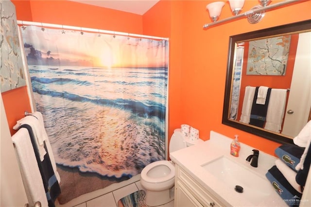 125 E Georgia Ruth Dr Unit B202, South Padre Island, TX 78597 - bathroom with toilet, tile patterned floors, vanity, and a shower with shower curtain