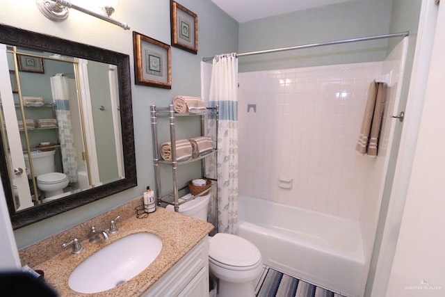 full bathroom featuring shower / bath combination with curtain, vanity, and toilet