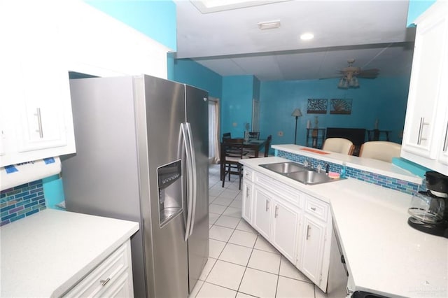 125 E Georgia Ruth Dr Unit B202, South Padre Island, TX 78597 - kitchen with light tile patterned floors, light countertops, stainless steel fridge with ice dispenser, and a sink