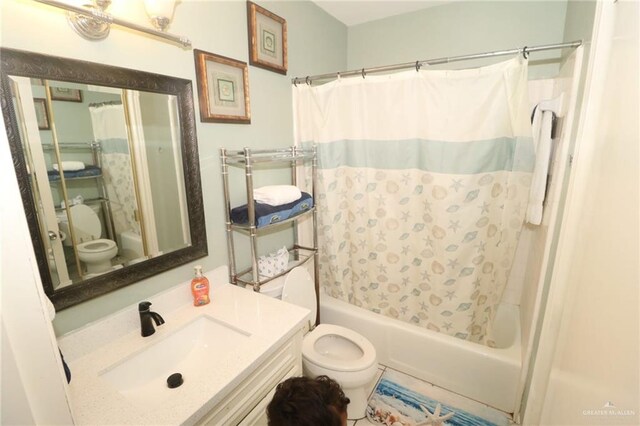 125 E Georgia Ruth Dr Unit B202, South Padre Island, TX 78597 - full bathroom featuring toilet, vanity, and shower / bath combination with curtain