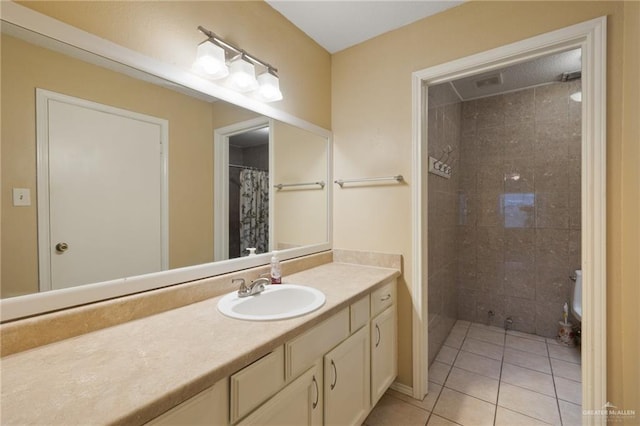 301 E Ln Vista Ave Unit Ut26, Mcallen, TX 78501 - full bath with tile patterned floors, vanity, and tiled shower