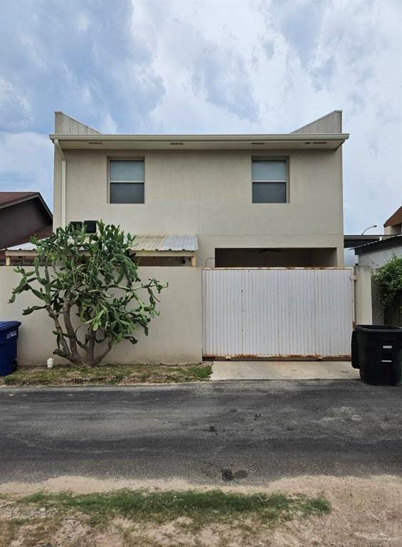 3109 S Casa Linda St, Mcallen, TX 78503 - view of front of property featuring stucco siding and a gate
