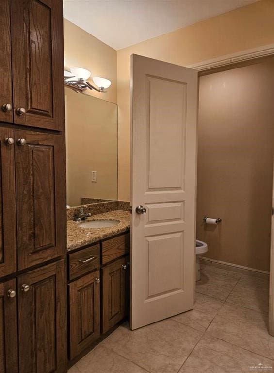 3109 S Casa Linda St, Mcallen, TX 78503 - bathroom featuring vanity, toilet, tile patterned flooring, and baseboards