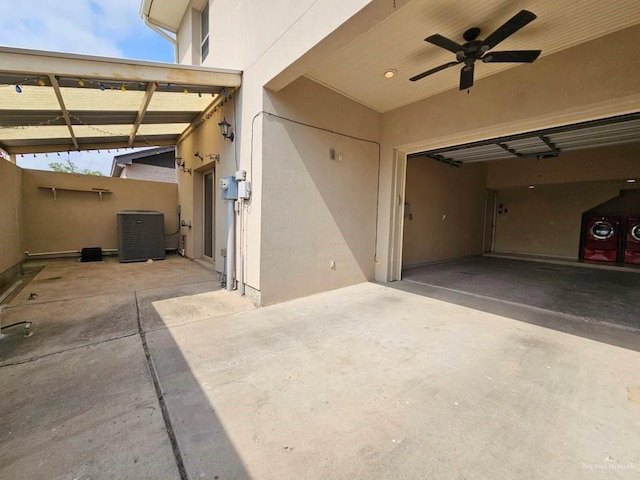 3109 S Casa Linda St, Mcallen, TX 78503 - view of patio / terrace with central air condition unit, a garage, a ceiling fan, and driveway