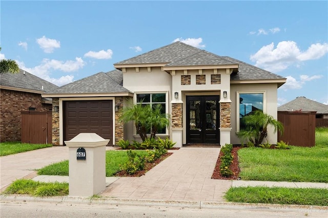 view of front of property featuring french doors and a garage