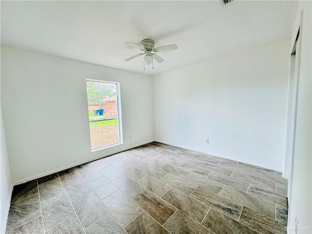 unfurnished room featuring ceiling fan