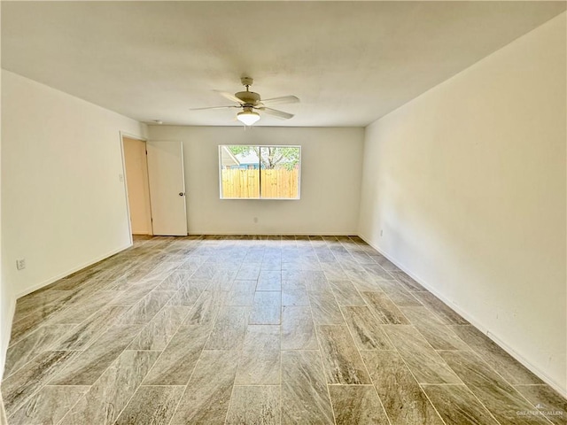 unfurnished room featuring ceiling fan