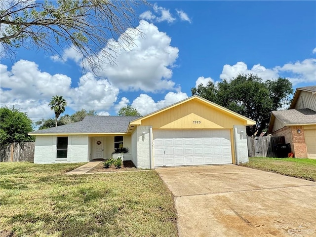 ranch-style house with a front yard and a garage