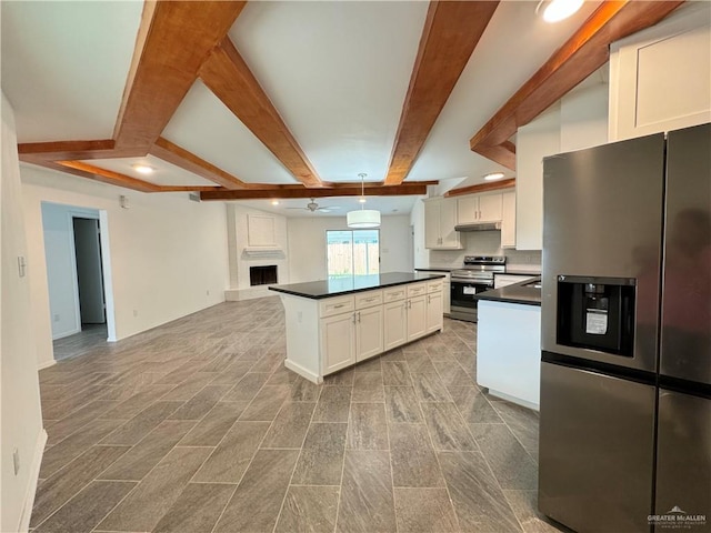 kitchen with stainless steel appliances, ceiling fan, decorative light fixtures, beamed ceiling, and white cabinets