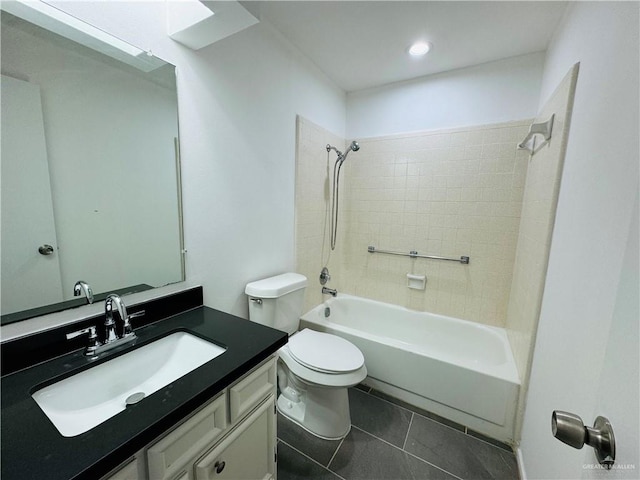 full bathroom featuring tile patterned floors, vanity, toilet, and tiled shower / bath