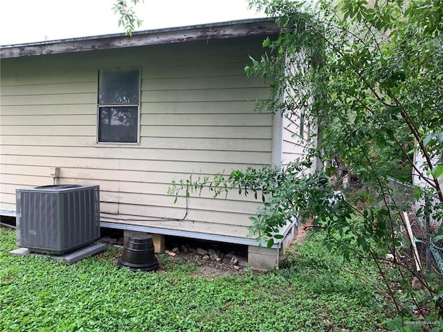 view of side of property with central AC unit