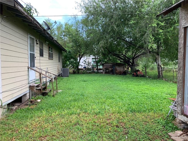 view of yard featuring central AC unit