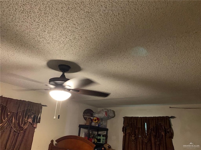 details featuring a textured ceiling and ceiling fan