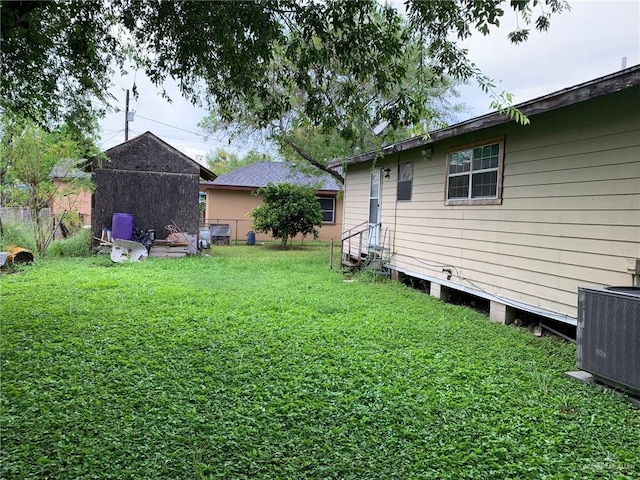 view of yard with central AC unit