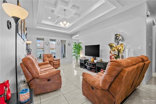 tiled living room featuring a chandelier and coffered ceiling